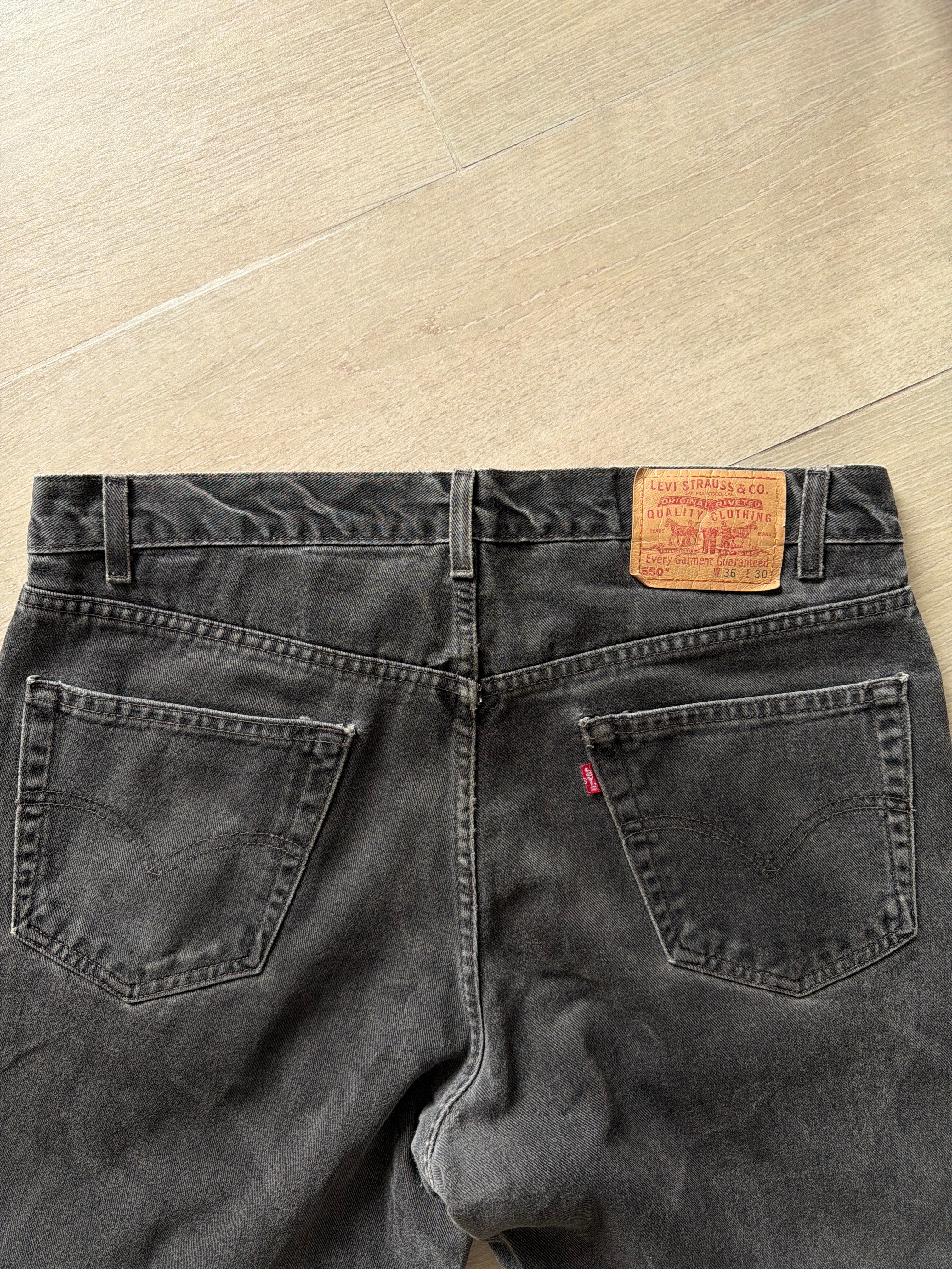 1990s Vintage Levis 550 Black Faded Jeans